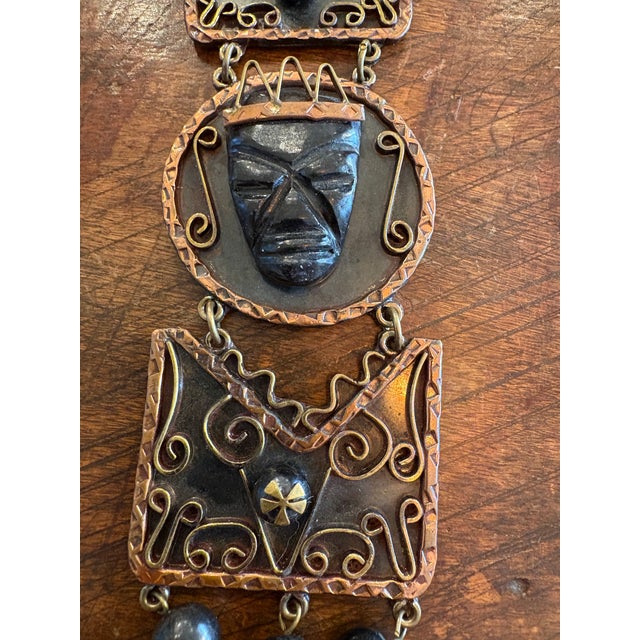 Stylish mid century Palm Royal style Aztec Black Onyx Carved Brass and Copper Vintage Necklace.