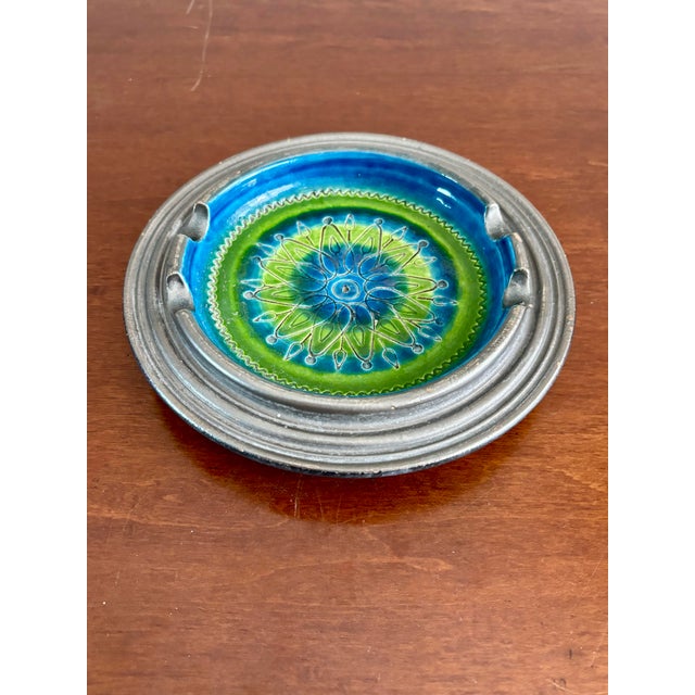 Vintage Italian ceramic ashtray by Bitossi, produced in the 1960s. The piece features a bold, balanced composition of blue...