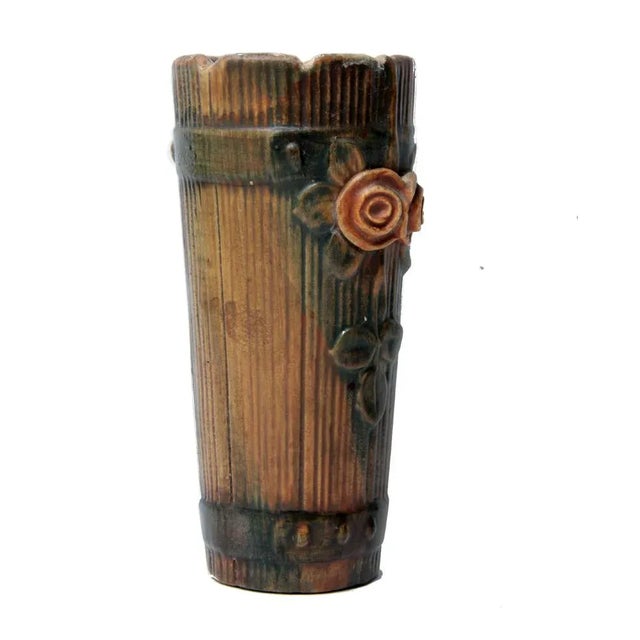 Add a charming touch to your decor with this fine antique wall pocket by Weller. This fine piece in the wood rose pattern...