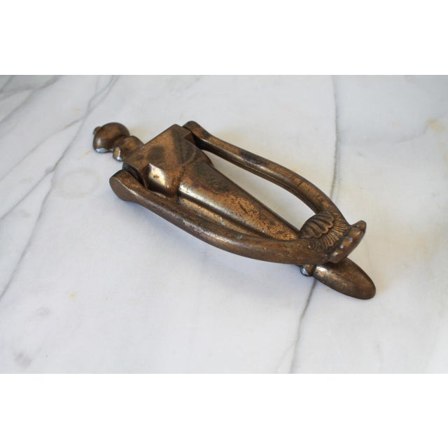 Vintage brass plated door knocker. No makers mark. Some age wear to brass finish. Hardware not included.