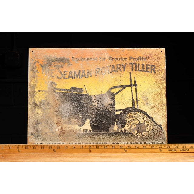 Antique lithographed tin advertising sign for the Seaman Rotary Tiller, manufactured by Seaman Motors, Inc. of Milwaukee,...