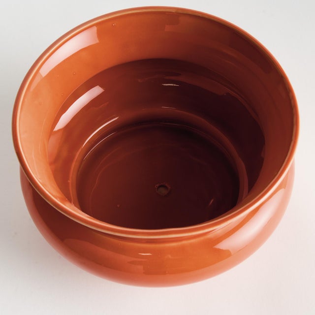 In a traditional English silhouette, this wide pot has a regal charm. Finished with a rich, orange reactive glaze and wide...