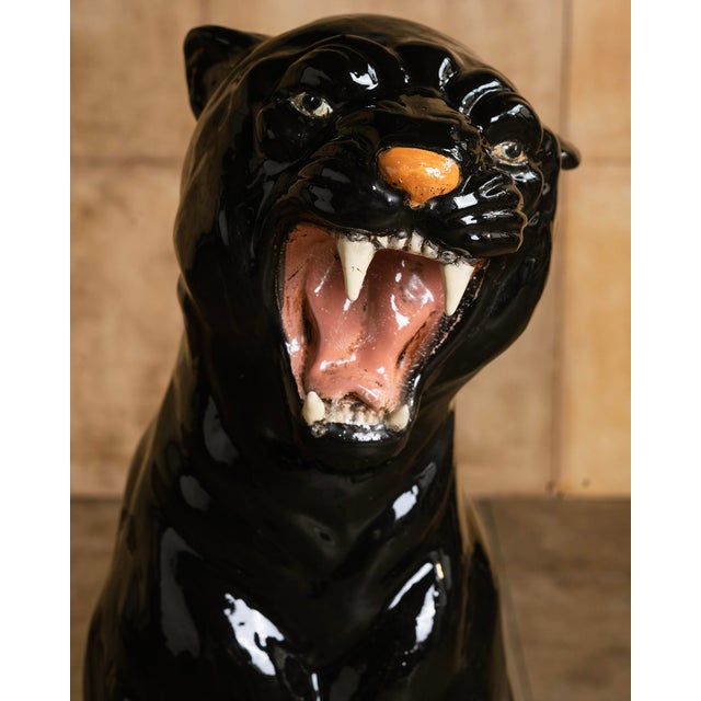 With its arched posture, roaring expression, and unmistakable presence, this large ceramic panther is one of the most...