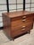 This exceptional four-drawer bachelors chest is a brilliant showcase of Jens Risom's refined American-Scandinavian design...