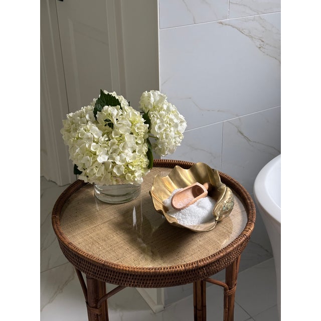 Sculptural and highly detailed catchall rendered in solid cast brass, modeled in an organic shell form with flowing ridges...