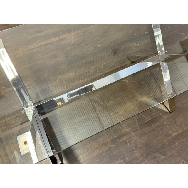 Design Plus Gallery presents a Chrome and Tempered Glass Dining Table. This style of table is popular in the late 20th...