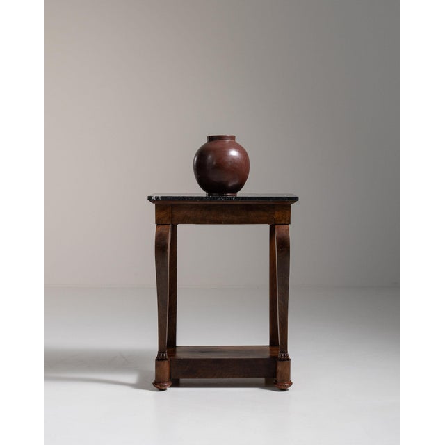 Ebonized pedestal side table in Deep Ebony Black. Finished in deep ebony black, this ebonized pedestal side table is...