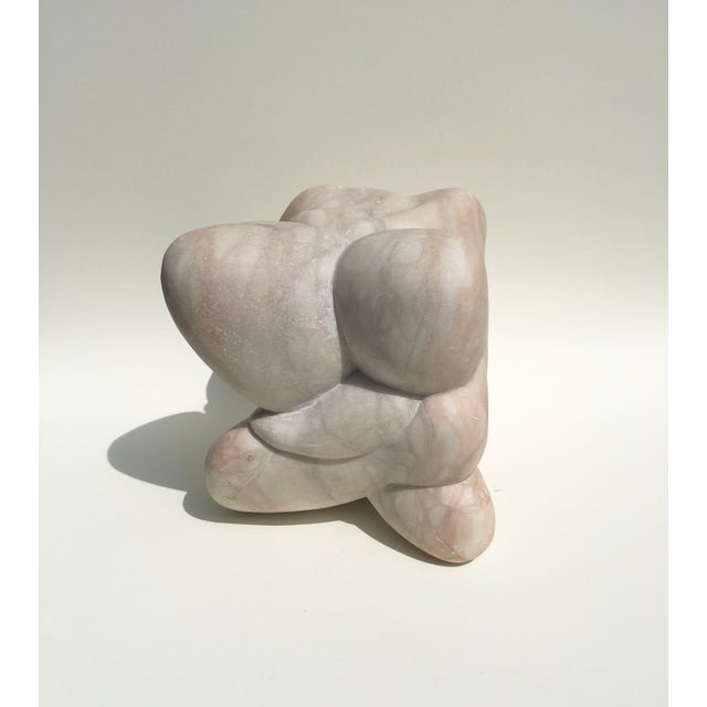 Mid-century biomorphic abstract sculpture in pale pink marble by Unknown artist.