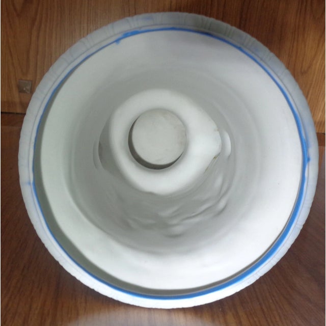 Celebrate the timeless beauty of classic English craftsmanship with this vintage Wedgwood Blue Jasperware Two-Handled Urn...