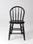 A vintage Windsor-style chair featuring a gracefully bowed back, turned spindles, and a shaped wooden seat, finished in...