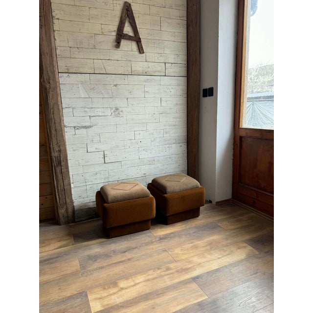 This stylish set of two mid-century modern ottomans from the 1950s features a beautiful combination of brown and beige...