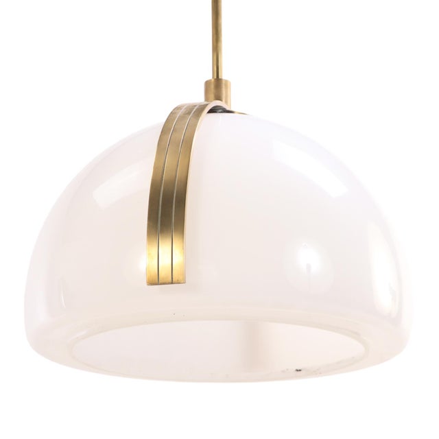 A refined dual-pendant light fixture distinguished by its elegant balance of sculptural simplicity and mid-century...