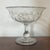 Antique 19th century American cut glass footed compote. Thumb and dot cut pattern with faceted rim. Bowl rises on a...