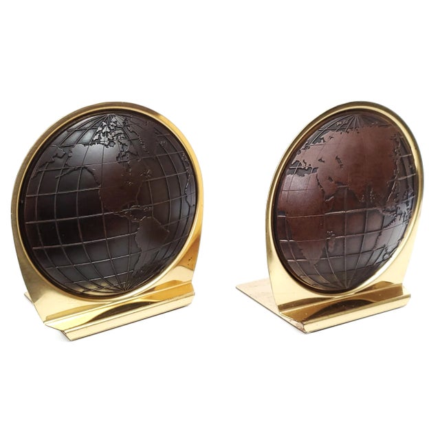 Offering a unique pair of World Atlas brass plated vintage bookends with dark brown vinyl centers, made by Matina...