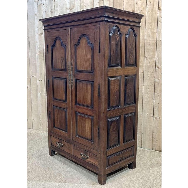 Small cabinet of Indian origin from the 1970s in teak and rosewood - H=1m73, D=60cm, L=1m13.