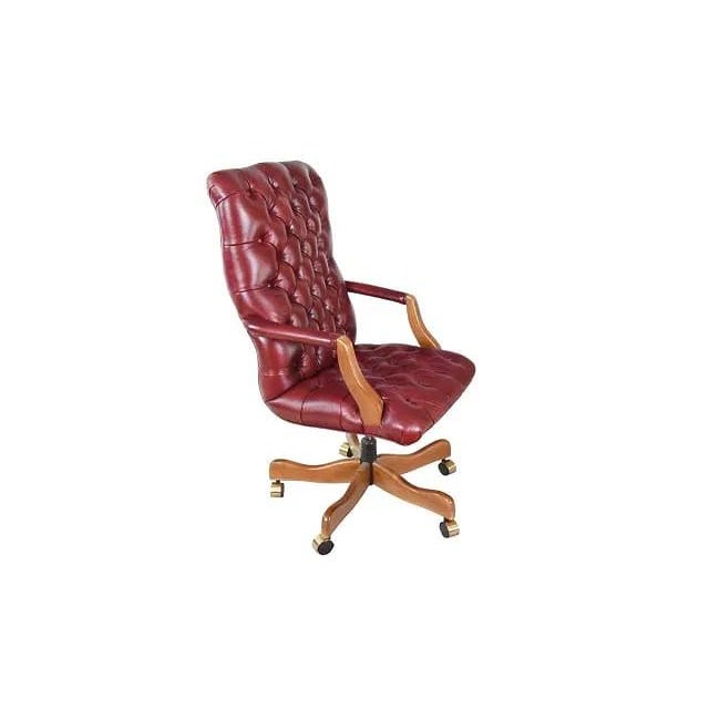 A very elegant Executive office chair upholstered in tufted brick red leather. The chair is a statement in office luxury...