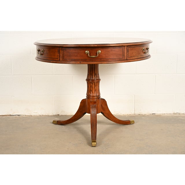 A gorgeous Georgian or Regency style pedestal three drawer drum side table or tea table By Hekman Furniture USA, Circa...