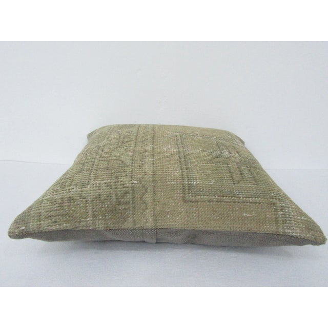 This is a pillow cover made from a vintage kilim rug. The piece was properly washed and ready to use. Pillow inserts not...