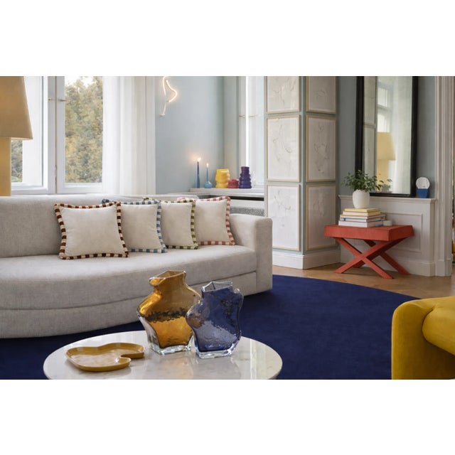 White Velvet Cushion with Two-Tone Fringe Trim A refined decorative cushion crafted in sumptuous velvet, enriched by a...