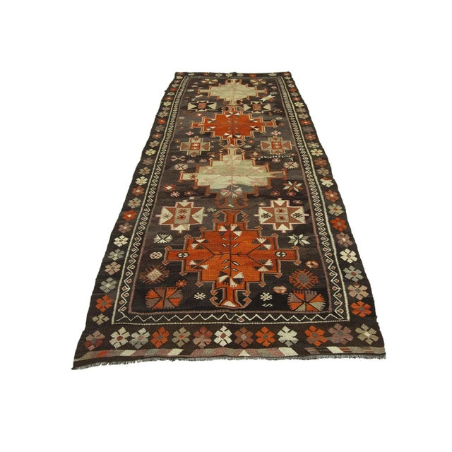 Vintage handwoven decorative kilim rug from Kars region of Turkey. Approximately 50-60 years old. In very good condition.