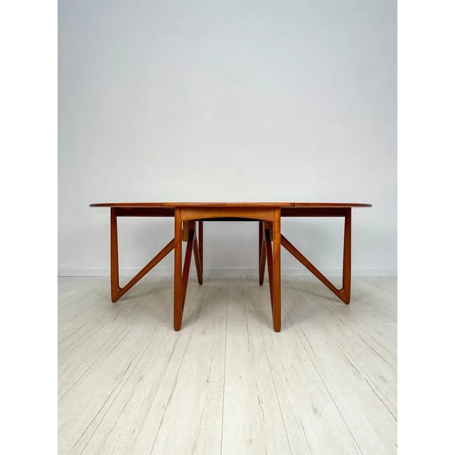 Unique dining table (model 304) manufactured in the 1960s. Design by Niels Koefoed for Koefoeds Hornslet. Oval, foldable...