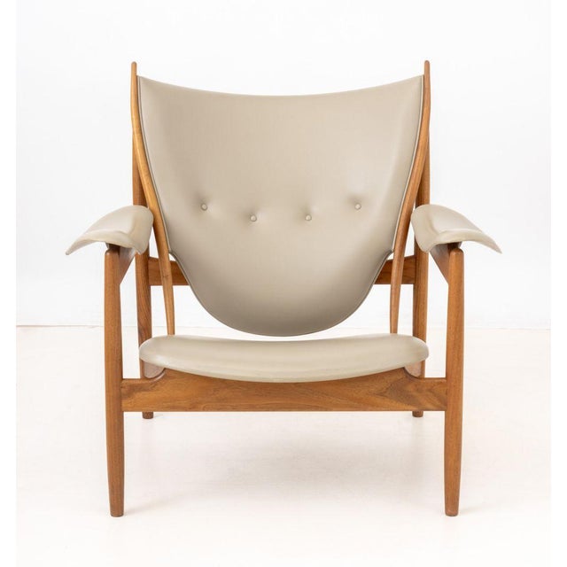 Finn Juhl (Danish, 1912-1989) "Chieftain" Lounge Chair, teak wood frame and tan leather upholstery, with "One Collection /...
