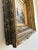 This antique coastal oil painting, from around 1845, shows a woman and her two children at the seashore, gathered around a...