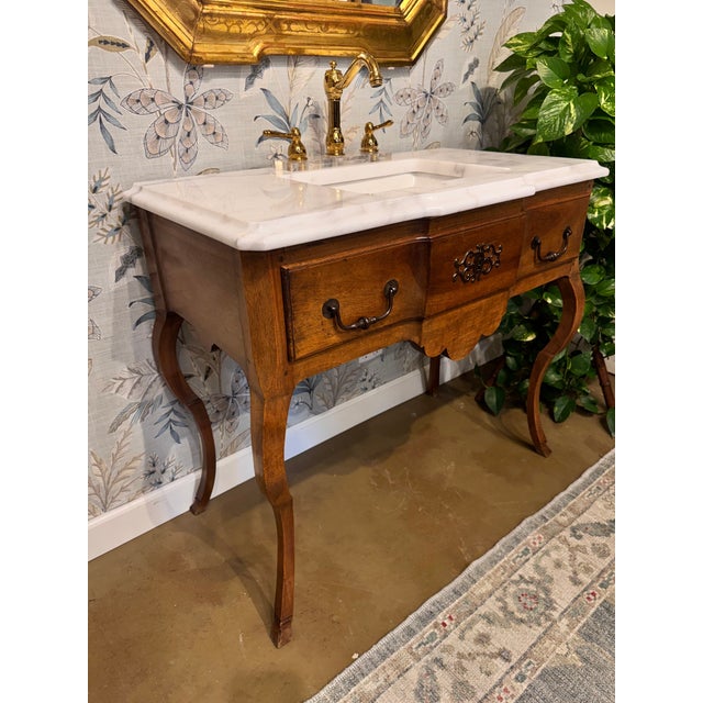 Ready to upstyle your bathroom space? This French walnut commode feels fresh and functional with the addition of a marble...