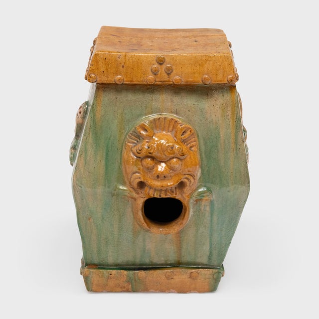 This low, ceramic garden drum is drip glazed in the manner of ancient Chinese sancai ware, cloaked in translucent shades...