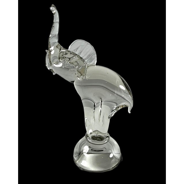 This clear art glass elephant sculpture is likely from Italian glassmaking traditions, particularly those of Murano ,...