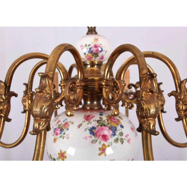Beautiful eight-arm chandelier made of patinated brass. The chandelier has a completely restored copper wiring - ready to...
