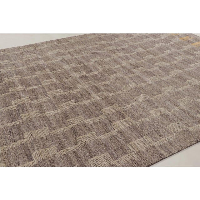 This 9x13 Art Deco rug is a striking addition to Rug & Kilim's plush collection of contemporary designs—a sophisticated...