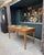 This antique country table in solid oak likely dates from the late 19th century. Its simple lines, slender legs, and warm...