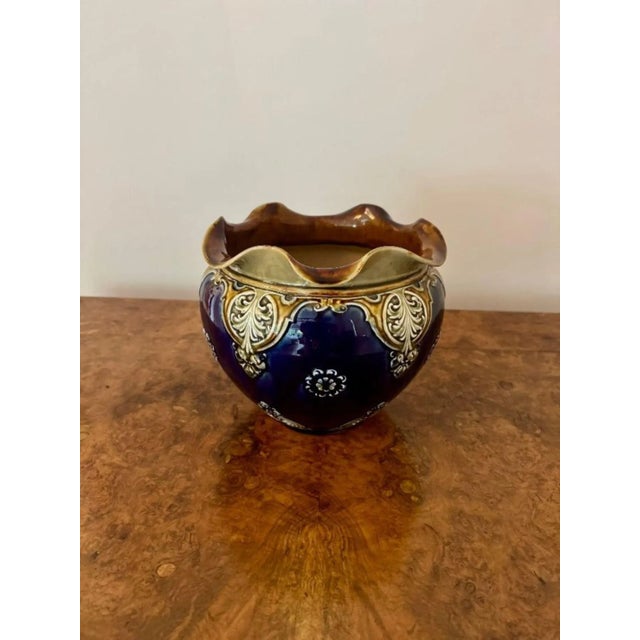 Wonderful antique Victorian quality Doulton Lambeth jardiniere having a wavy shaped top, decorated with flowers on a blue...