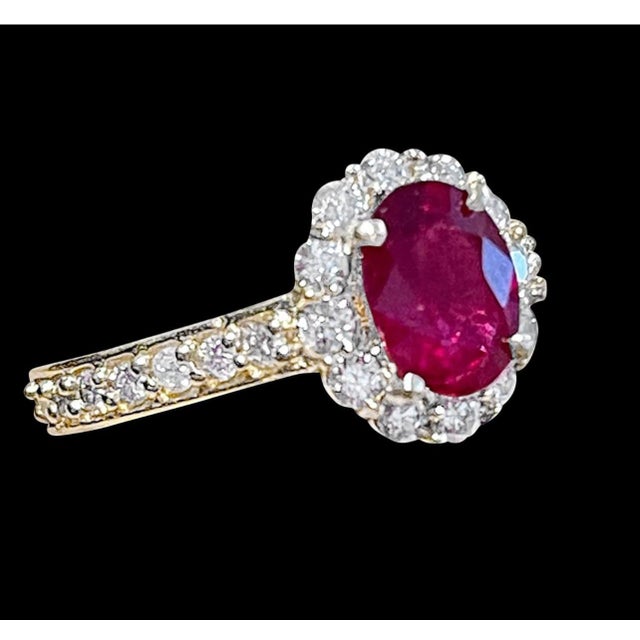 2010s Oval 1.5 Carat Treated Ruby and 1.20 Carat Diamond 14 Karat Yellow Gold Ring For Sale - Image 5 of 18