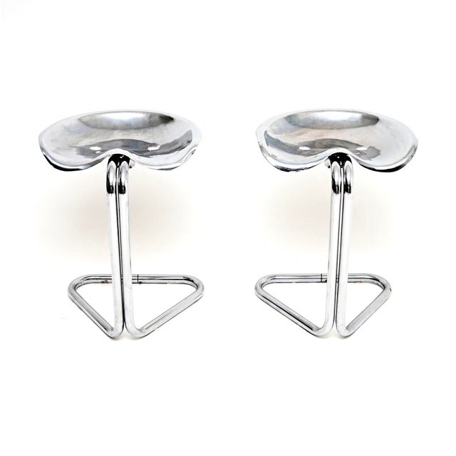 A stylish and iconic pair of Vintage tractor stools by Rodney Kinsman for OMK. They were made in England, they date from...
