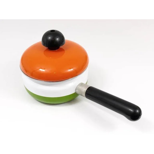 A beautiful enameled pot with lid, designed by Carl Aubock Vienna. Executed by Riess, Austria, 1970s. Diameter without...