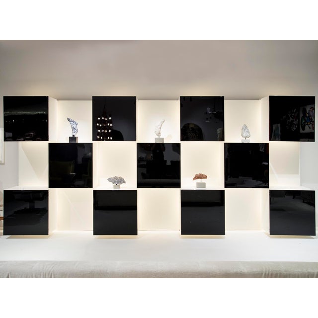 This piece can be separated in 7 panels for shipping and the square compartments are removable too. This piece has an...