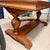 19th Century Oak Library Table A handsome antique library table featuring carved pedestals and feet on the trestle base....