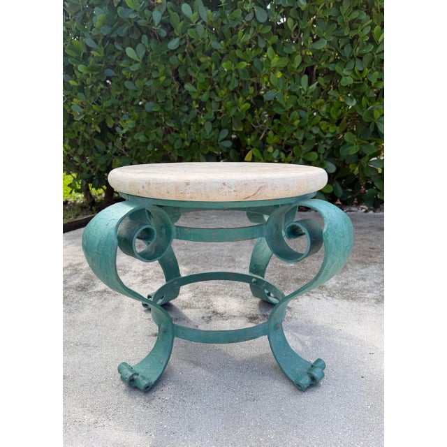 Vintage hand-painted iron petite cocktail table with a turquoise and teal finish and gold-painted accent details...