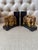 A charming pair of elephant bookends featuring intricate carved style details. Each elephant is sculpted with raised ears,...