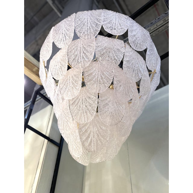 Luxury modern gold 24k chandelier with white graniglia “Petals” in Murano glass. Hand-made in Murano glass , all made in...