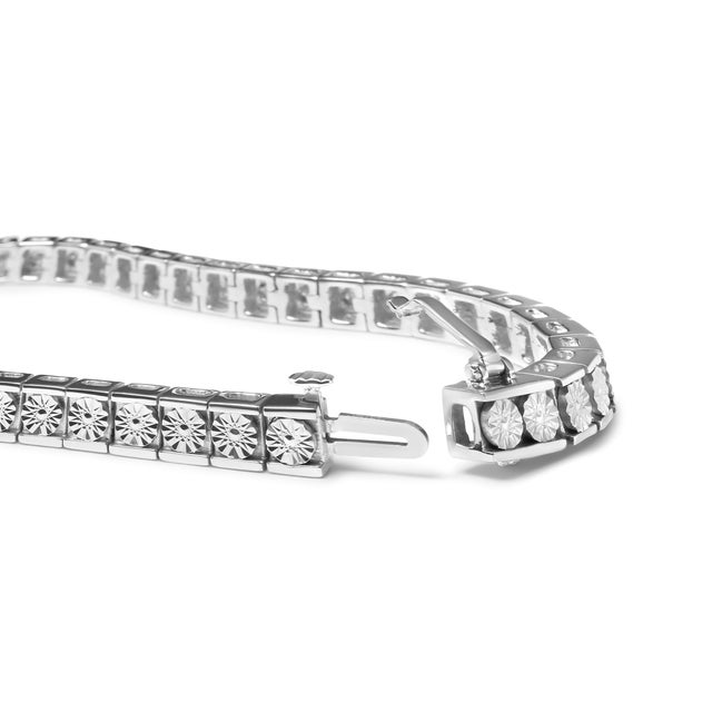 Enhance your jewelry collection with a stunning and elegant addition. This beautiful sterling silver tennis bracelet...