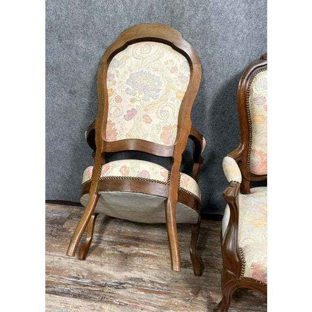 Pair of napoleon iii period mahogany armchairs, circa 1850 floral upholstery wide, comfortable seats curved legs h 100 x w...
