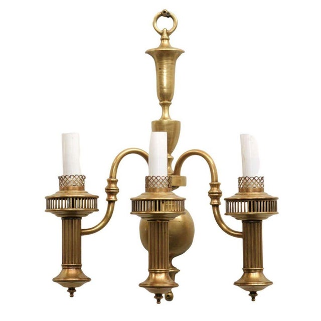 American colonial solid brass wall sconce with 3-tier oil lamp style electric sockets. This solid brass wall sconce exudes...