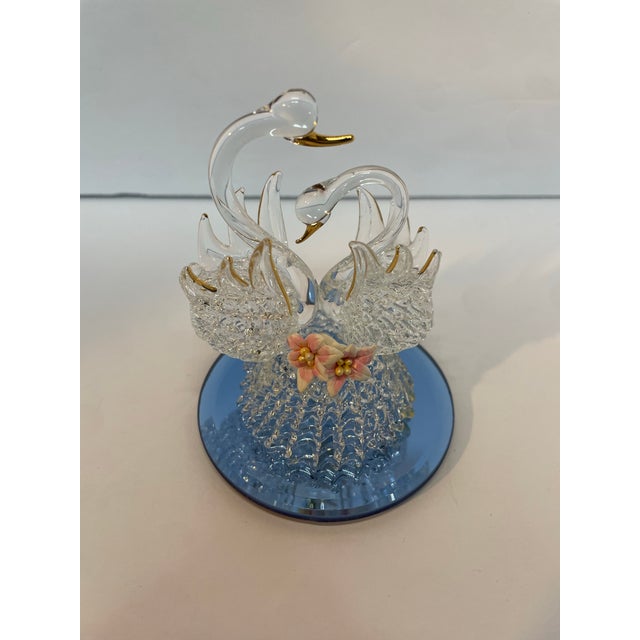 This vintage Swanson figurine is a stunning piece of art glass that features a beautiful pair of in love swans on a mirror...