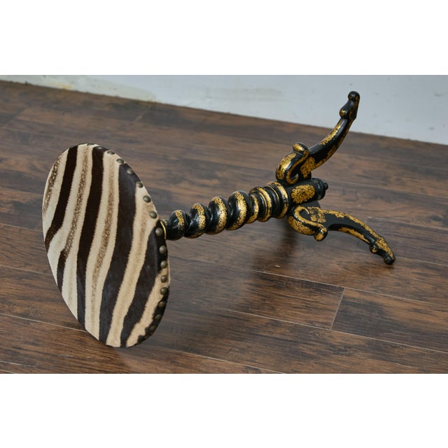 An English Victorian period barley Twist accent table from the 19th century with ebonized and gilt finish. This elegant...