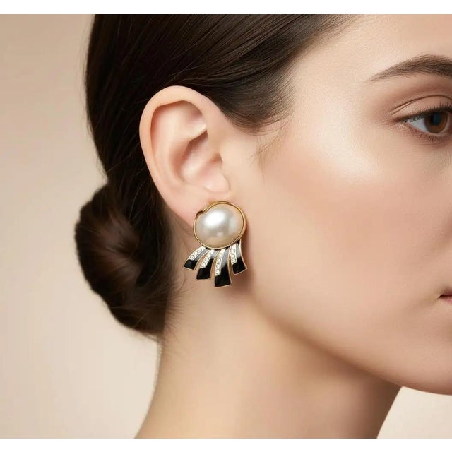 These vintage-inspired costume earrings offer a bold and sophisticated aesthetic characteristic of 1980s glamour. Each...