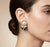 These vintage-inspired costume earrings offer a bold and sophisticated aesthetic characteristic of 1980s glamour. Each...