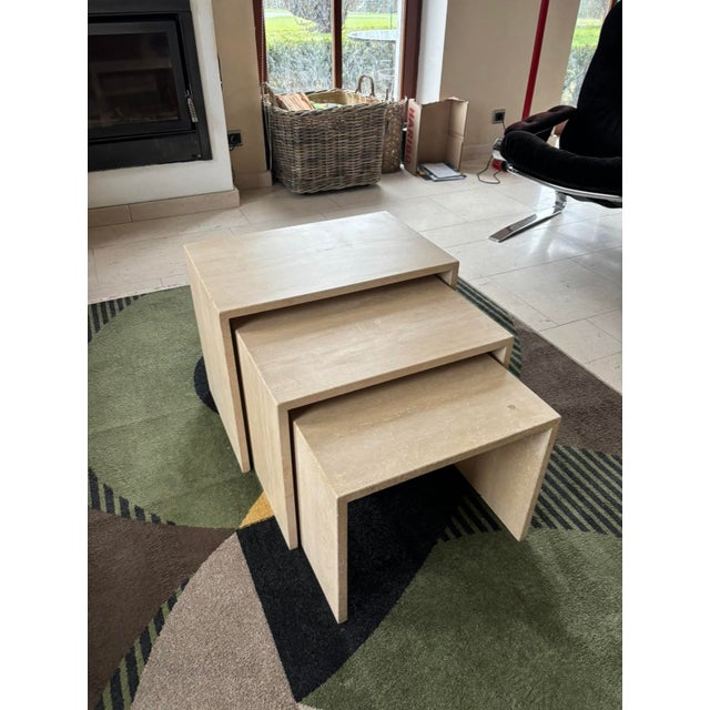 Three side tables, made in italy in the 1970s from solid travertine marble, have a very elegant, minimalist design. The...